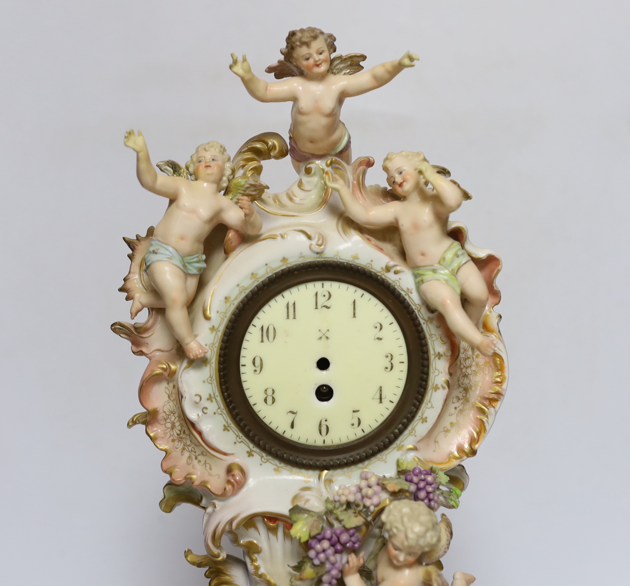 A Continental porcelain figural mantel clock, no movement